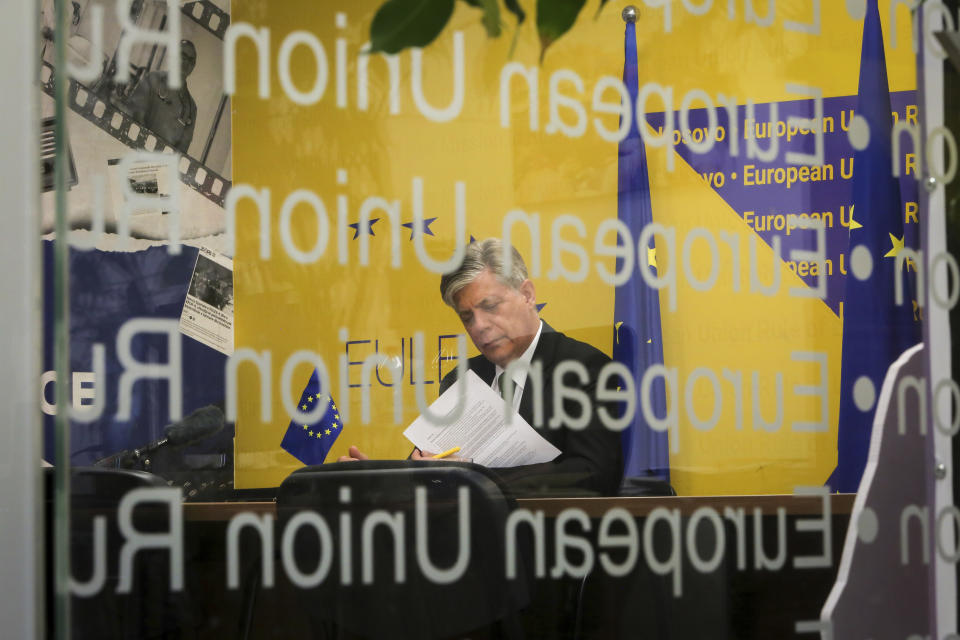 Head of Mission of the European Union Rule of Law Mission in Kosovo Lars-Gunnar Wigemark reads a letter, in Kosovo's capital Pristina on Thursday, June 8, 2023. (AP Photo/Visar Kryeziu)