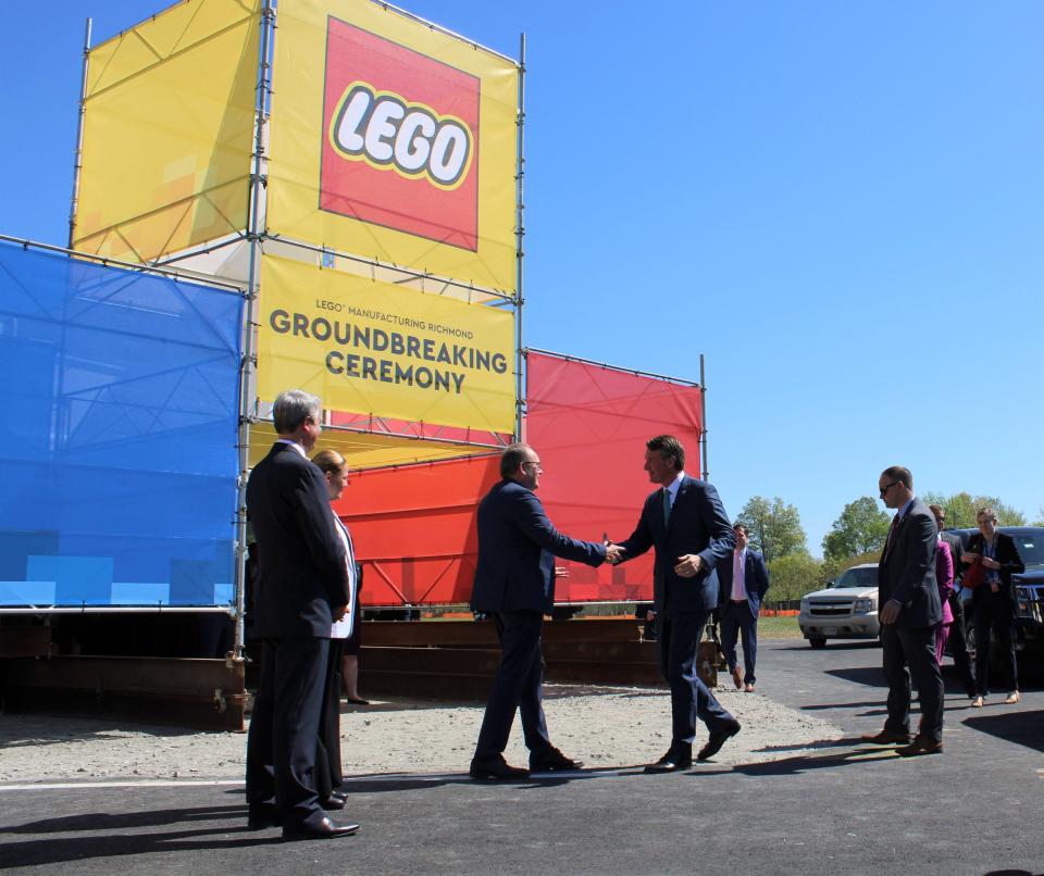 On the left, LEGO Group Chief Operations Officer Carsten Rasmussen and Governor Glenn Youngkin shake hands at the LEGO Manufacturing Richmond groundbreaking ceremony in Chester, Va. on April 13, 2023.