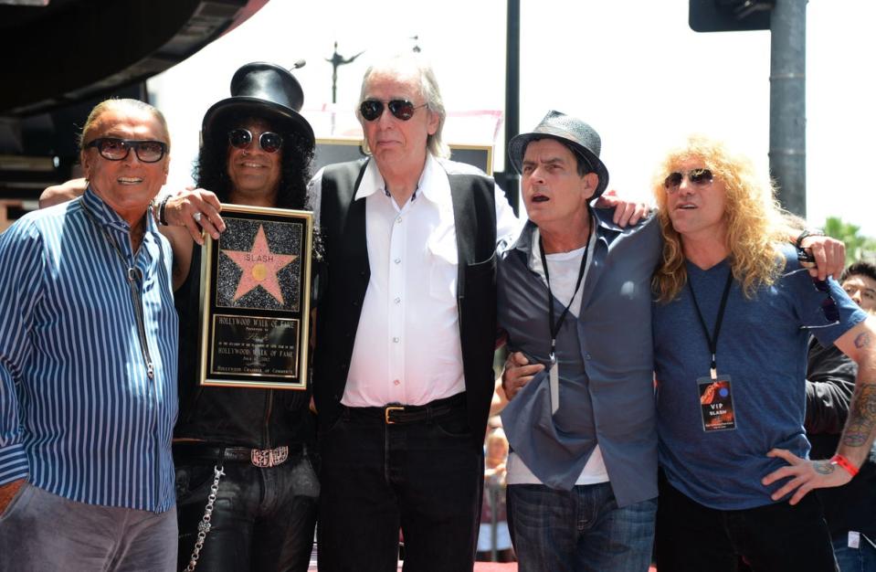 Jim Ladd (centre) with Slash (second from left) who was honoured with a Star on the Hollywood Walk of Fame in 2012. Also pictured: producer Robert Evans, actor Charlie Sheen and Steven Adler (Getty Images)