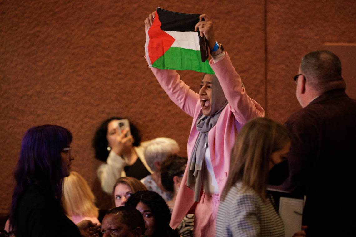 A protester holding a Palestinian flag disrupts Vice President Kamala Harris as she speaks at the Mexican Heritage Plaza in San Jose during her nationwide “Fight for Reproductive Freedoms” tour event on Monday.