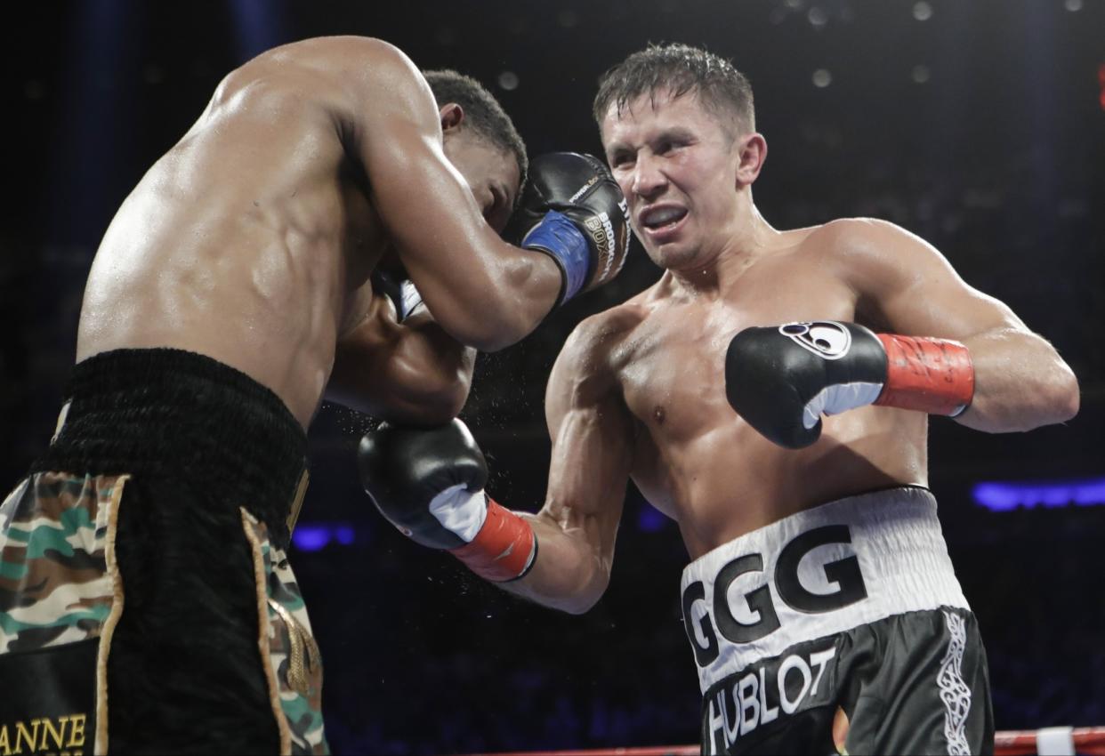 Gennady Golovkin, right, lands against Daniel Jacobs during the 11th round Saturday night. (AP)