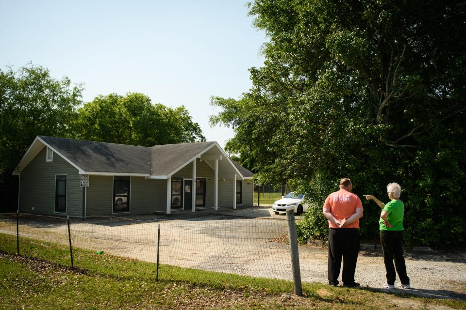 Fayetteville residents Tim Baugus and Joyce Pendergrass stand outside the Carolina Women's Clinic on Gillespie Street to hand out pamphlets to patients as they leave the clinic in Fayetteville on Tuesday, May 3, 2022.