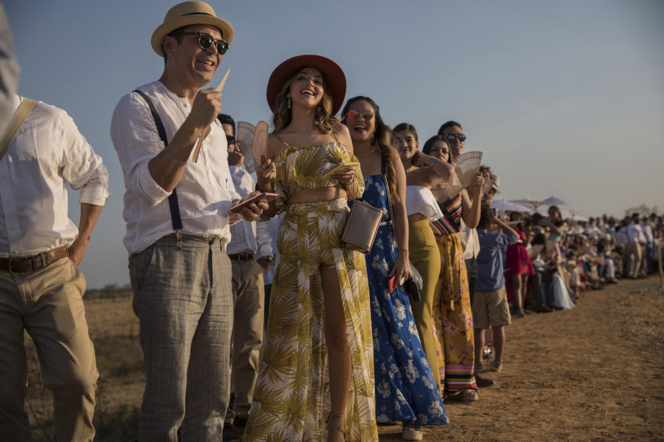 In this Feb. 16, 2019 photo, guests wait for groom Juan Jose Pocaterra and bride Maria Fernanda Vera to arrive to their destination wedding in Acarigua, Venezuela. The wedding guests included wealthy landowners, opposition politicians and a former student leader who nearly lost an eye during an anti-government protest. (AP Photo/Rodrigo Abd)