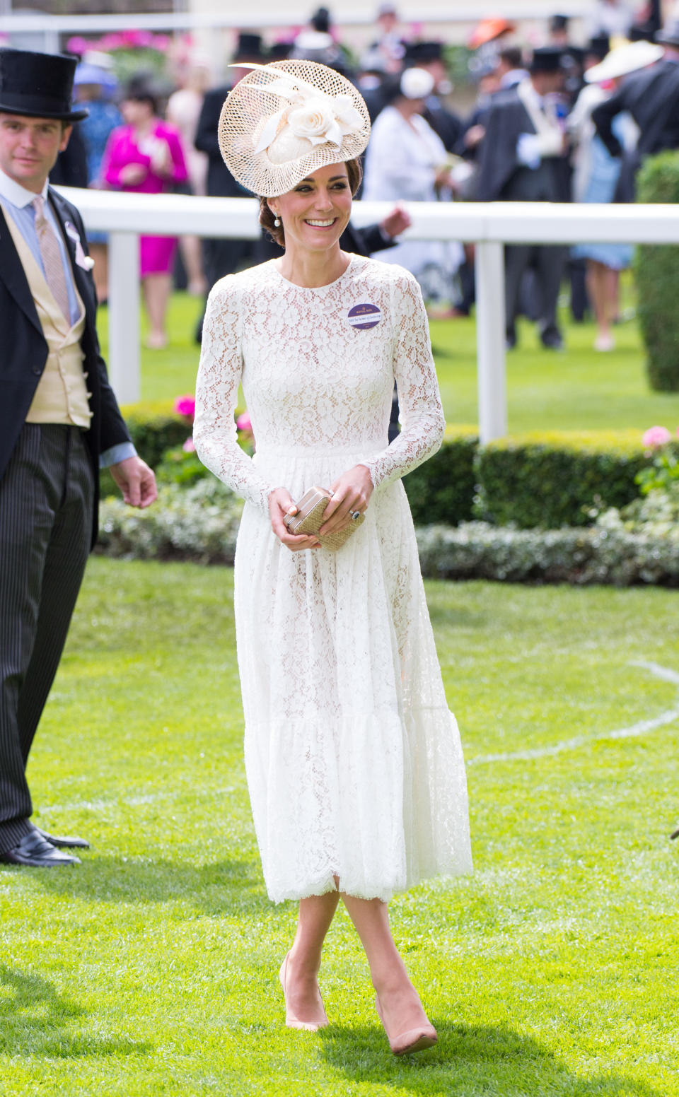<p>For the first day of Royal Ascot 2017, the Duchess of Cambridge opted for a lace midi dress by Alexander McQueen. The look was reminiscent of a Dolce and Gabbana number she wore to the event. She teamed the dress with Gianvito Rossi heels. <em>[Photo: Getty]</em> </p>