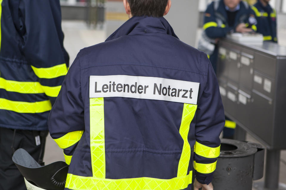 Wiesbaden, Germany - October 25, 2014: Emergency doctor in charge at casualty collection point (Verletztensammelstelle) during a large mass casualty incident drill with German emergency services in the city center of Wiesbaden.