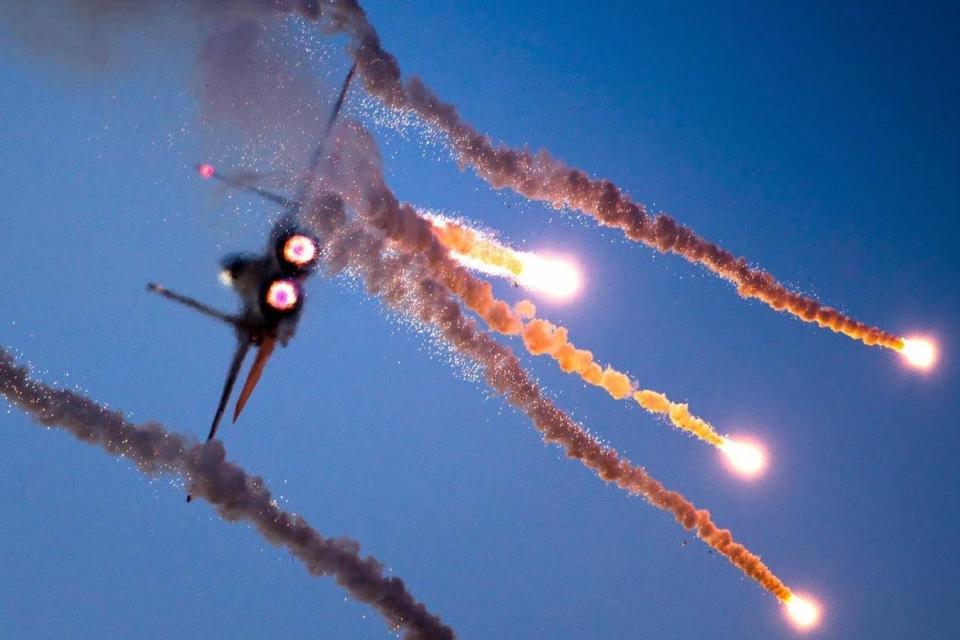The F-15I fighter jet firing flares