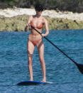<p>Martha Hunt goes paddle boarding while in Mexico on Thursday with fiancé Jason McDonald.</p>