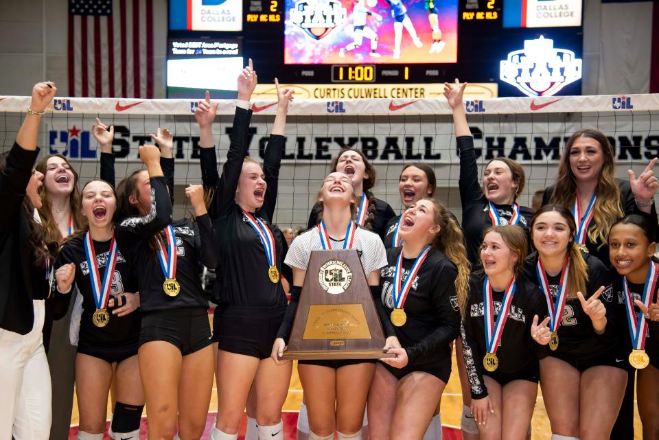 Canyon Randall players cheer after winning against Aubrey to claim the UIL 4A State Volleyball Championship at the Curtis Culwell Center in Garland, Texas on Saturday, Nov. 19, 2022. Canyon Randall won the game in three sets. (Emil Lippe/For The Amarillo Globe-News)