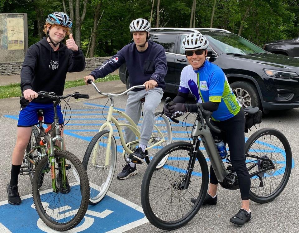 Scott Hamilton, with sons Maxx, left, and Aiden, after finishing a 444-mile bike ride for cancer awareness. Maxx and Aiden joined their father for the last few miles of the ride.