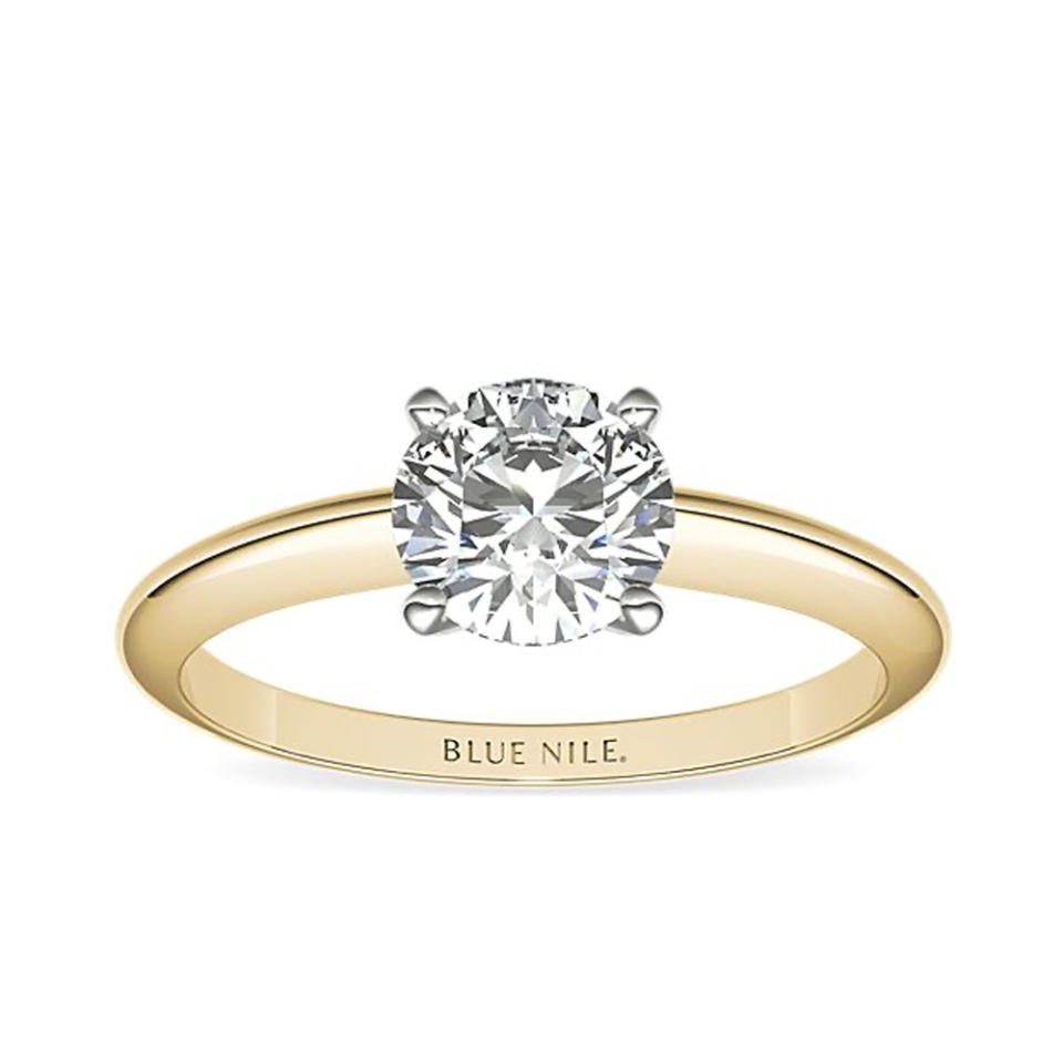 Blue Nile Classic Four Prong Solitaire Engagement Ring In 18k Yellow Gold on white background