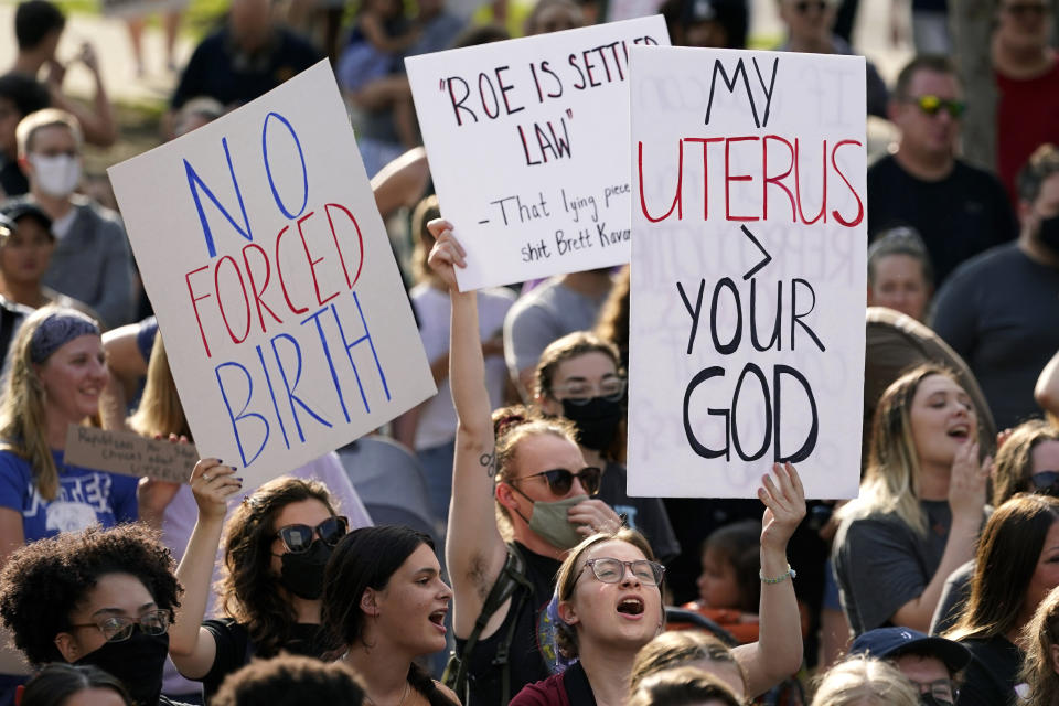 FILE - Abortion-rights protesters cheer at a rally, June 24, 2022, in Des Moines, Iowa. A new poll from from AAPI Data and The Associated Press-NORC Center for Public Affairs Research shows that Asian Americans, Native Hawaiians and Pacific Islanders in the U.S. are highly supportive of legal abortion, even in situations where the pregnant person wants an abortion for any reason. (AP Photo/Charlie Neibergall, File)