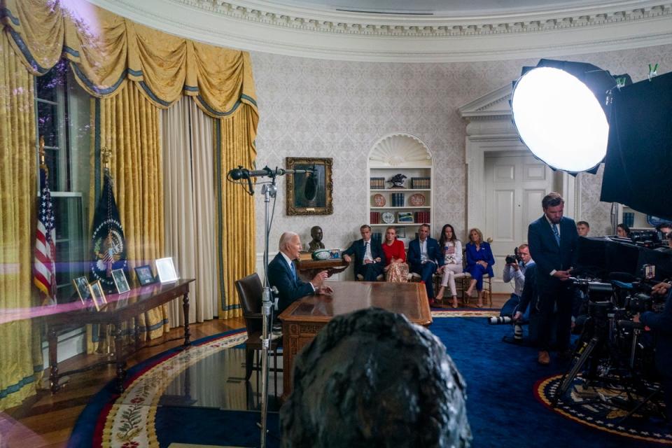President Joe Biden with family members nearby as he delivers remarks during an address from the Oval Office of the White House (EPA)