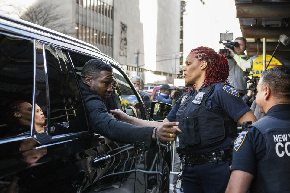 Actor Jonathan Majors shakes hands with court police officers after leaving Criminal Court after his sentencing on Monday April 8, 2024 in New York. (AP Photo/Brittainy Newman)