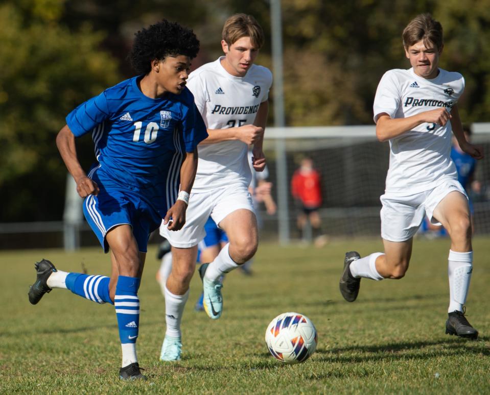 Memorial’s Kortlen Sears (10) takes the ball down the field as Providence Pioneers defenders pursue during the Memorial Tigers vs Providence Pioneers for the IHSAA 2A Boy’s Regional Championship game at Gwaltney Sports Complex in Washington, Ind., Saturday afternoon, Oct. 15, 2022. 