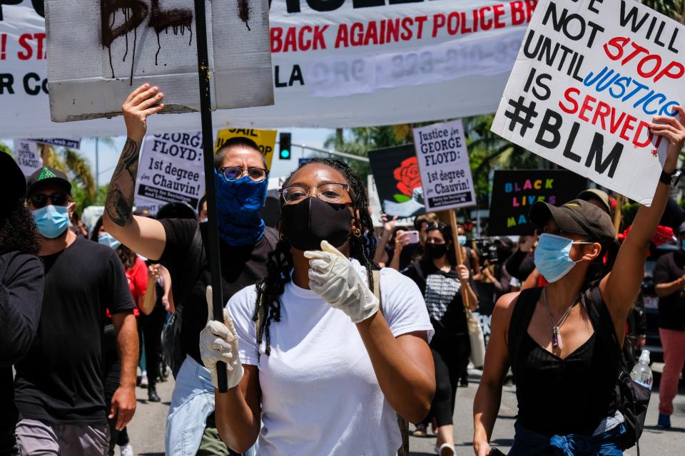 Protestors march through the streets of Los Angeles on March 30. Photo by Stacey Leasca.