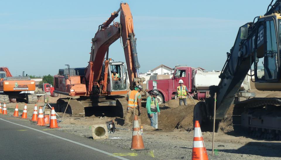 Work crews install a sewer line along one stretch of Bear Valley Road in Apple Valley. The sewer line is being installed by the developer of a new gas station located on the southwest corner of Deep Creek and Bear Valley roads.