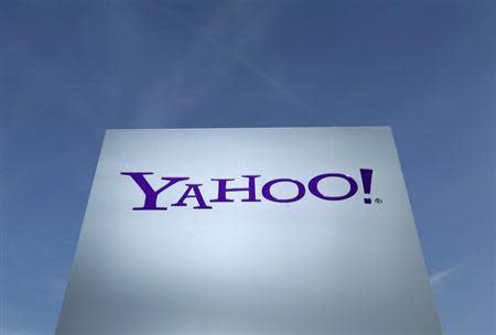 A Yahoo logo is pictured in front of a building in Rolle, 30 km (19 miles) east of Geneva, in this file picture taken December 12, 2012. REUTERS/Denis Balibouse