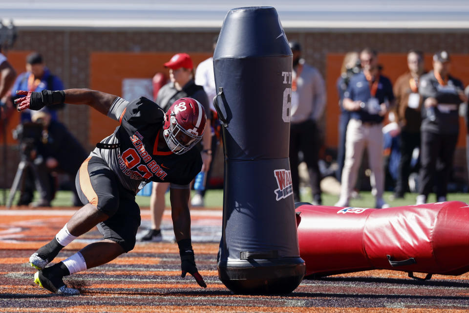 American defensive lineman Justin Eboigbe of Alabama runs through drills during practice for the Senior Bowl NCAA college football game, Wednesday, Jan. 31, 2024, in Mobile, Ala. (AP Photo/ Butch Dill)