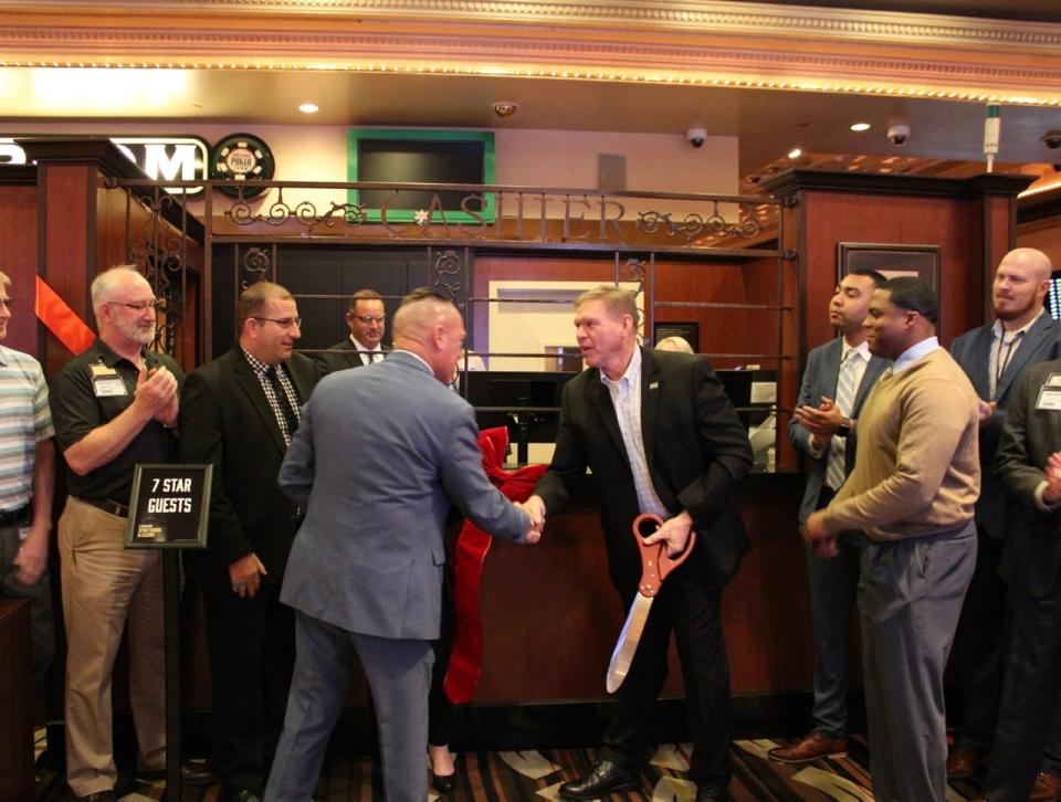 Horseshoe Casino General Manager Robert Urland and Bossier City Mayor Tommy Chandler at the recent ribbon cutting for the Caesars Sports Book in Bossier City.
