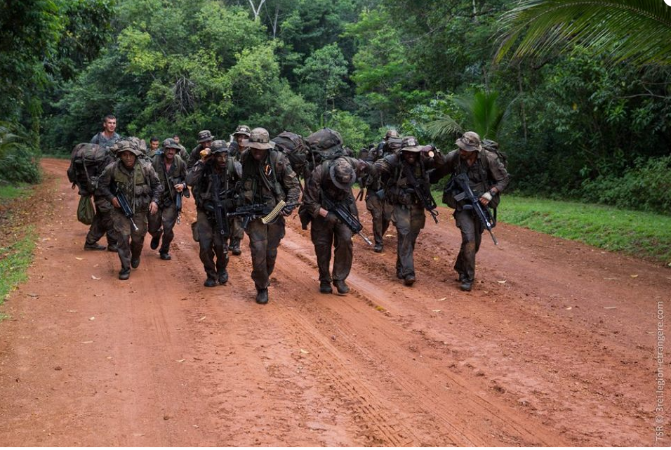 gdf soldiers walk on a dirt road