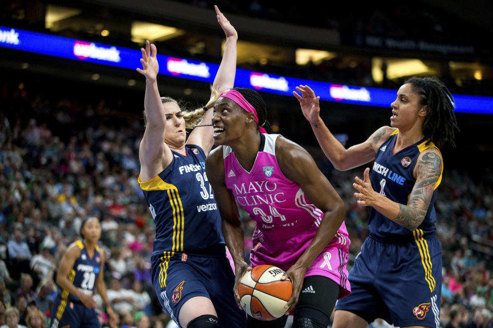 Minnesota Lynx center Sylvia Fowles (C) works through two Indiana Fever defenders during an Aug. 18, 2017, WNBA game. (AP)