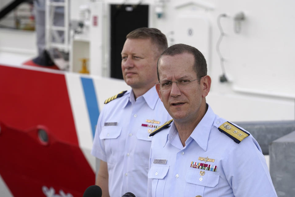 U.S. Coast Guard Rear Adm. John Mauger, commander of the First Coast Guard District, right, speaks to members of the media as Capt. Jason Neubauer, chief investigator, U.S. Coast, left, looks on during a news conference, Sunday, June 25, 2023, at Coast Guard Base Boston, in Boston. The U.S. Coast Guard said it is leading an investigation into the loss of the Titan submersible that was carrying five people to the Titanic, to determine what caused it to implode. (AP Photo/Steven Senne)