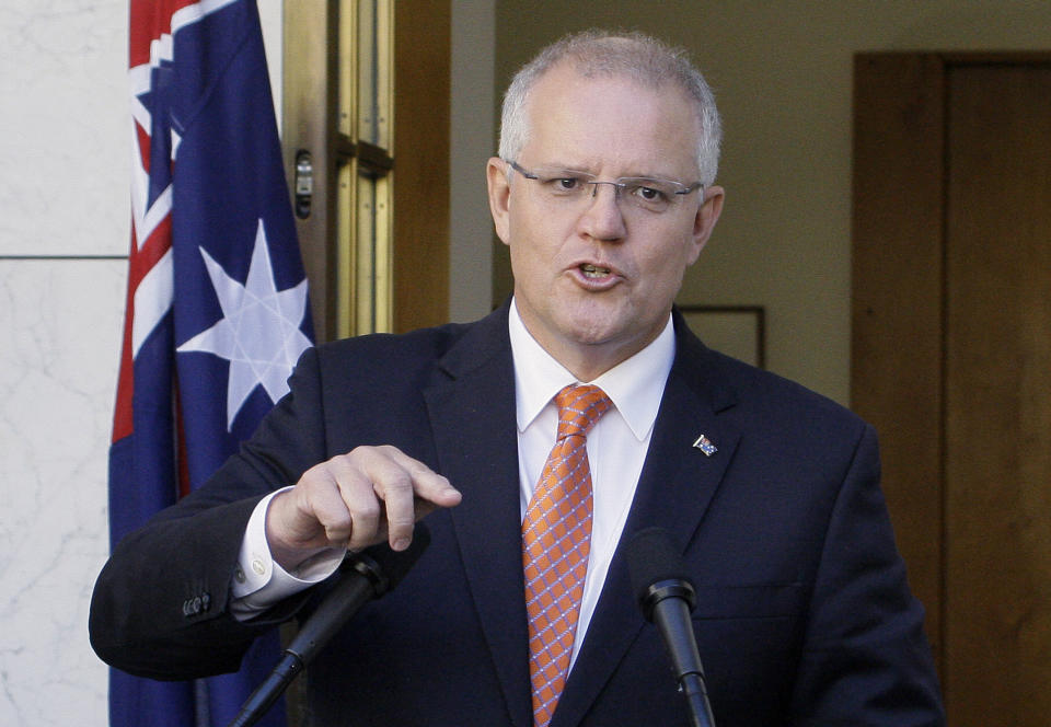 FILE - In this Feb. 13, 2019, file photo Australian Prime Minister Scott Morrison addresses media at Parliament House in Canberra. Morrison, on Tuesday, March 26, 2019, accused an influential minor political party of trying to "sell Australia's gun laws to the highest bidders" by asking the U.S. gun lobby for donations. (AP Photos/Rod McGuirk, File)