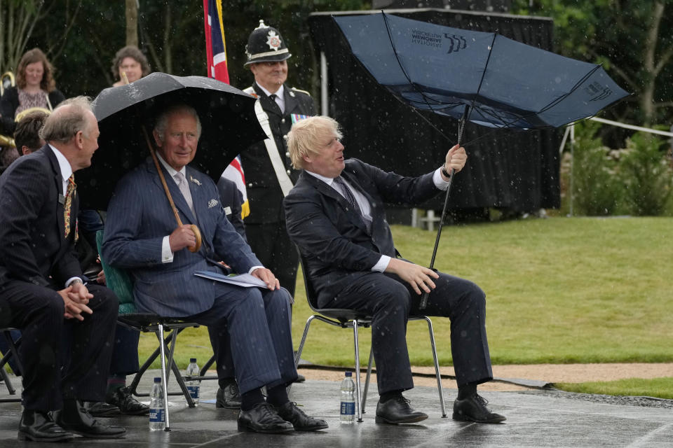 <p>The Prince of Wales (centre) looks on as Prime Minister Boris Johnson opens an umbrella at the unveiling of the UK Police Memorial at the National Memorial Arboretum at Alrewas, Staffordshire. The �4.5 million memorial commemorates all personnel who have lost their lives since the 1749 formation of the Bow Street Runners. Picture date: Wednesday July 28, 2021.</p>
