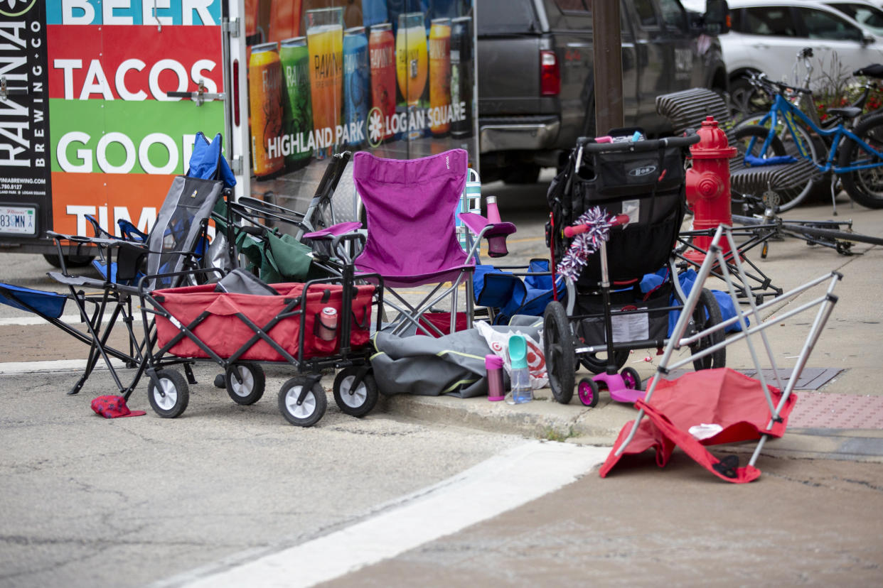 Seats used by parade watchers are left abandoned at the scene after a mass shooting at a Fourth of July parade (Jim Vondruska / Getty Images)