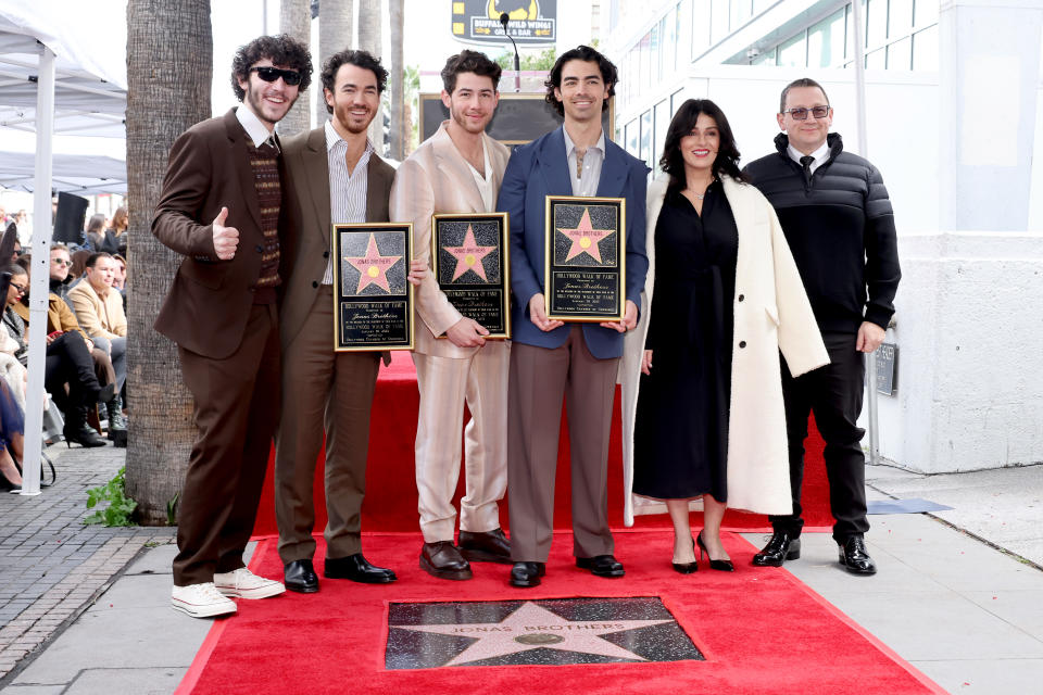 HOLLYWOOD, CALIFORNIA - JANUARY 30: (Second from L-R) Kevin Jonas, Nick Jonas, and Joe Jonas of The Jonas Brothers, and (L-R) Frankie Jonas, Denise Miller-Jonas, and Paul Kevin Jonas Sr. attend The Hollywood Walk of Fame star ceremony honoring The Jonas Brothers on January 30, 2023 in Hollywood, California. (Photo by Amy Sussman/Getty Images)