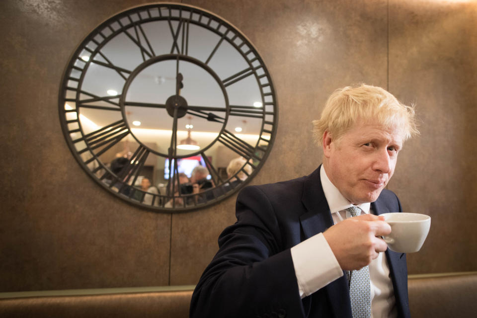 Conservative party leadership candidate Boris Johnson has a drink in the Munch and Wiggles cafe in Oxshott, Surrey.