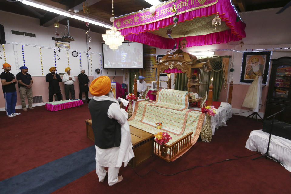***HOLD FOR RELIGION TEAM STORY*** Priest (Bhai) Ram Singh is shown performing rituals during the Shri Guru Ravidass Sabha ceremony at a temple in Fresno, Calif. Sunday, May 7, 2023. Members of the Ravidassia community in California are followers of Guru Ravidass, a 14th century Indian guru of a caste formerly considered untouchable. The Ravidassia community statewide is advocating for new legislation to outlaw caste-based discrimination. (AP Photo/Gary Kazanjian)