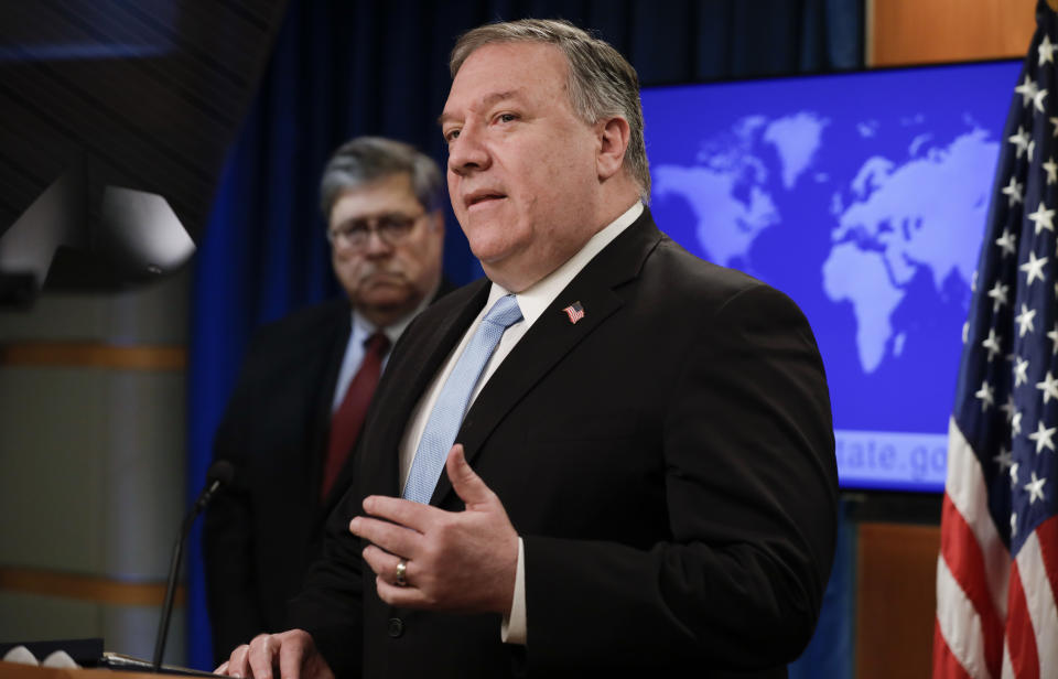 US Secretary of State Mike Pompeo (R) holds a joint news conference on the International Criminal Court with US Attorney General William Barr (L, rear), at the State Department in Washington, DC, on June 11, 2020. (Yuri Gripas/AFP via Getty Images)