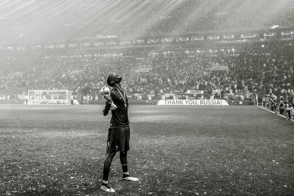 <p>MOSCOW, RUSSIA – JULY 15: (EDITORS NOTE: This image has been converted to black and white) Paul Pogba of France celebrates with the World Cup Trophy following his side victory in the 2018 FIFA World Cup Russia Final between France and Croatia at Luzhniki Stadium on July 15, 2018 in Moscow, Russia. (Photo by David Ramos – FIFA/FIFA via Getty Images) </p>