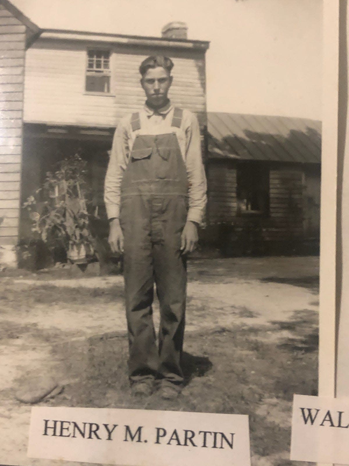 The late Henry Munt Partin strikes a pose in front of his childhood home in Matoaca, Va.