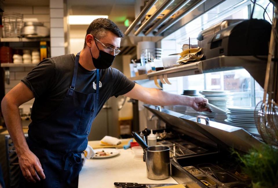Chef Eric Alexander, co-owner of Restaurant Josephine, works in the kitchen during dinner service.