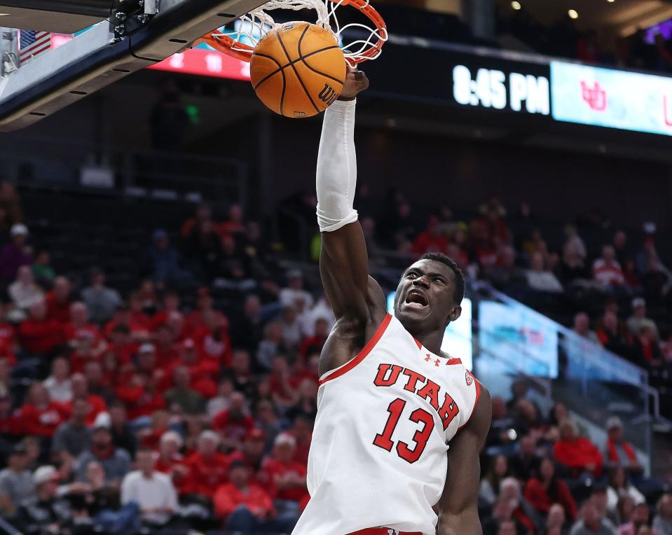 Utah Utes center Keba Keita (13) dunks at the Delta Center in Salt Lake City on Thursday, Nov. 30, 2023. Utah won 79-66. | Jeffrey D. Allred, Deseret News