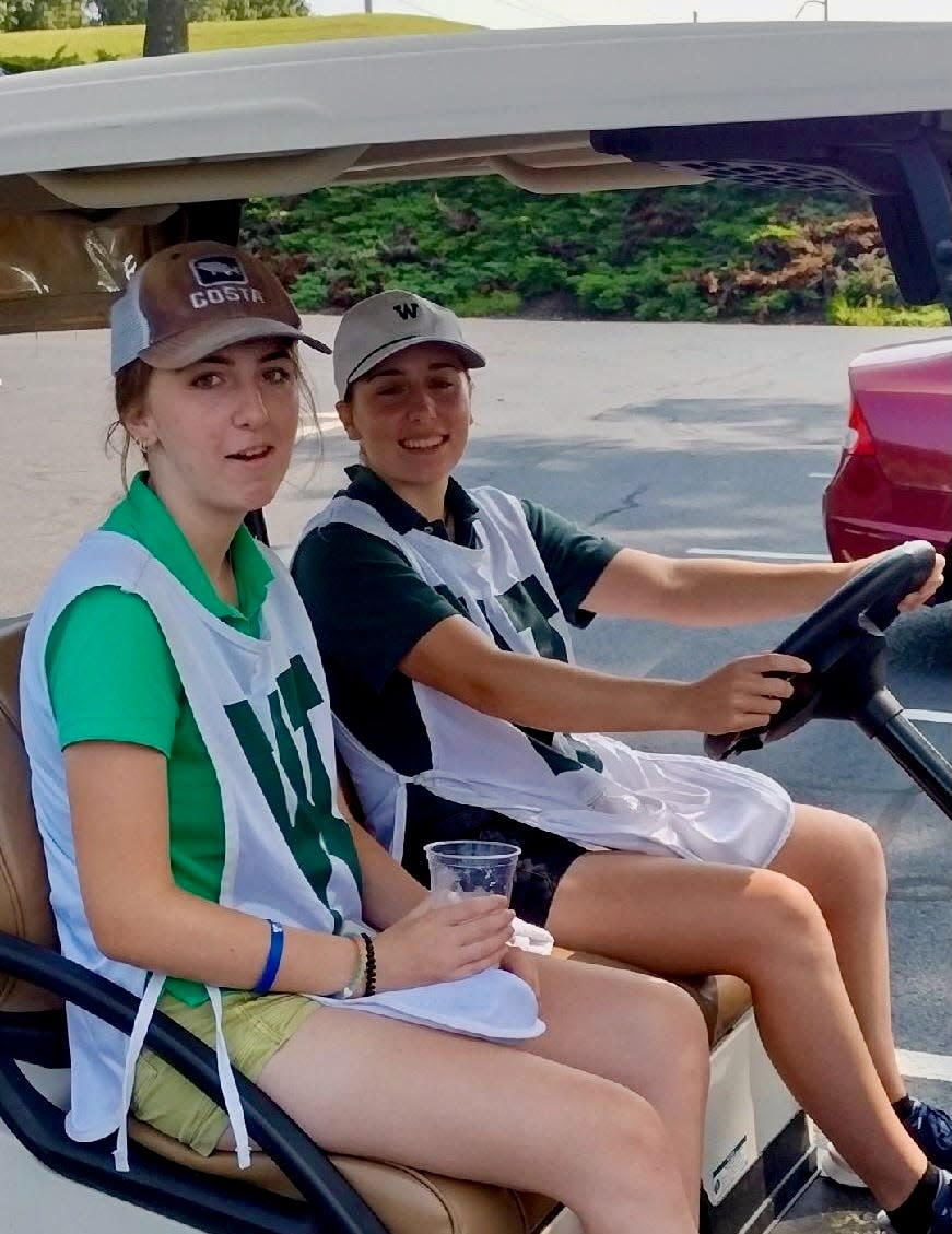 Rachel and Chloe Jeniski getting ready to caddie at Worcester CC.