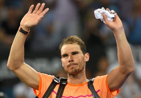 Tennis - Brisbane International - Pat Rafter Arena, Brisbane, Australia - 6/1/17 - Spain's Rafael Nadal reacts as he walks off the court after losing his match against Canada's Milos Raonic. REUTERS/Steve Holland