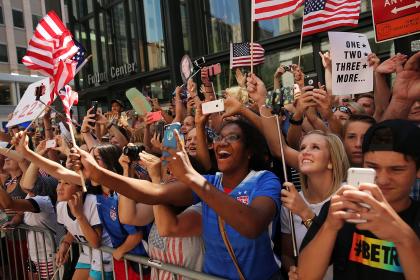 NEW YORK, NY - JULY 10:  Thousands of fans cheer as the World Cup-winning U.S. women&#39;s soccer team make their way up the The Canyon of Heroes along Broadway during a  ticker-tape parade on July 10, 2015 in New York City. Following the parade the team celebrated at ceremony at City Hall. According to city records, New York City has hosted 205 parades since 1886 along the Canyon of Heroes, which is located along Broadway between the Battery and City Hall.  (Photo by Spencer Platt/Getty Images)