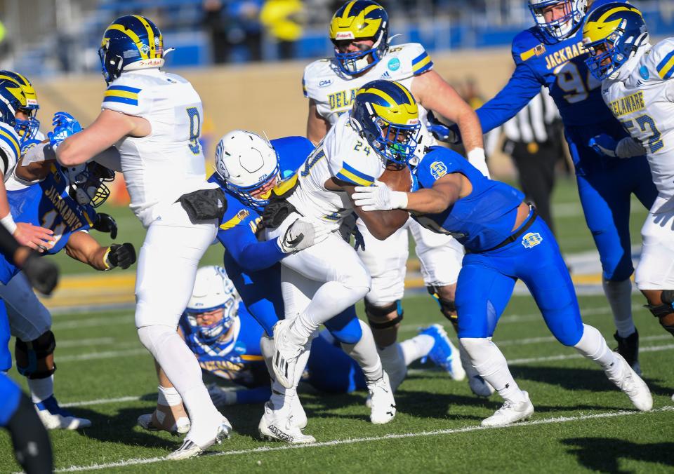 Delaware’s Kyron Cumby carries the ball during an FCS playoff game against South Dakota State on December 3, 2022, at Dana J. Dykhouse Stadium in Brookings.