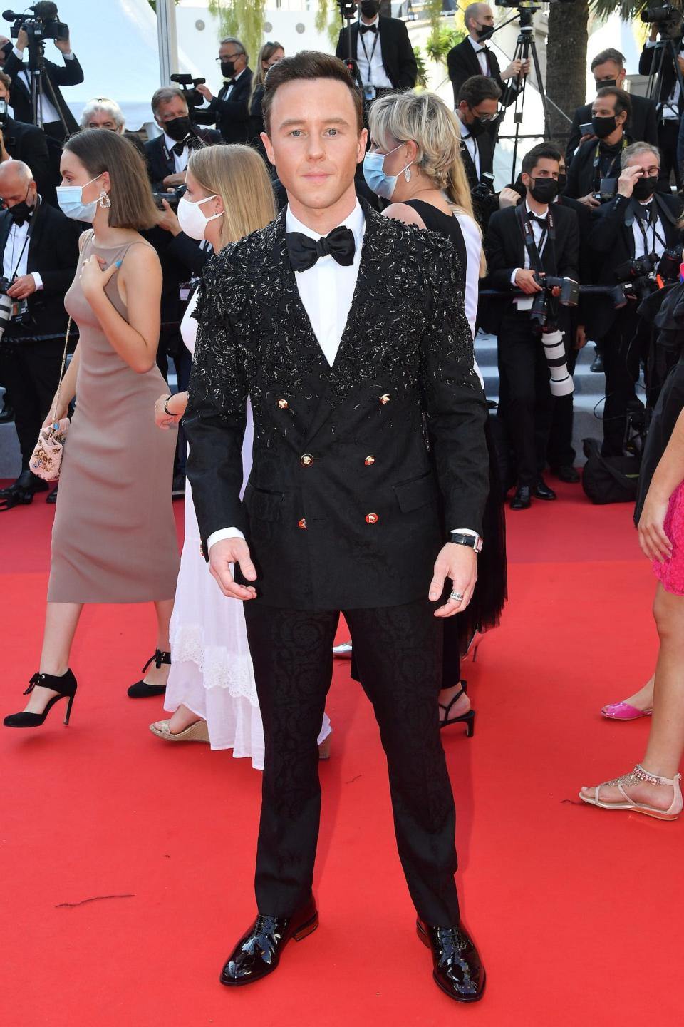 Matthew Postlethwaite wears a beaded suit at the 2021 Cannes Film Festival.
