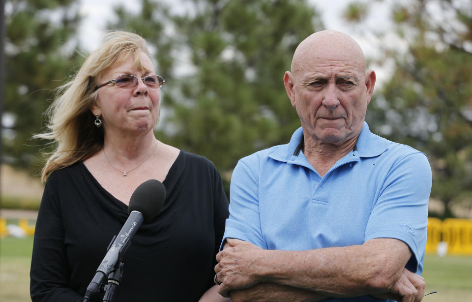 Lonnie and Sandy Phillips, whose daughter Jessica Ghawi was killed in the 2012 Aurora movie theatre attack, speak with members of the media on the day of the reading of the verdict in penalty phase 2 of the James Holmes trial at the Arapahoe County District Court in Centennial, Colo., Monday, Aug. 3, 2015. Jurors declined to rule out the death penalty Monday as they now move toward sentencing Holmes. The decision clears the way for one last attempt from both sides to sway the jury with gripping testimony from victims about their harm and suffering as well as the defense's appeals to show mercy. (AP Photo/Brennan Linsley)