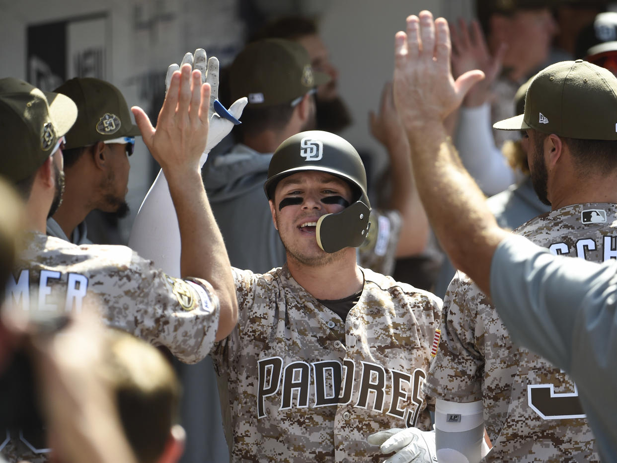 SAN DIEGO, CA - SEPTEMBER 22: Ty France #11 of the San Diego Padres is congratulated after hitting a two-run home run during the the fourth inning of a baseball game against the Arizona Diamondbacks at Petco Park September 22, 2019 in San Diego, California.  (Photo by Denis Poroy/Getty Images)