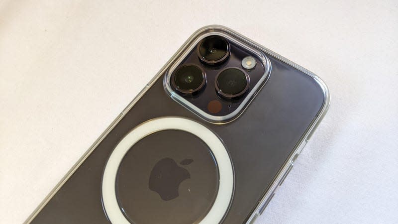 The iPhone 14 Pro with its tri- camera array in a clear case.