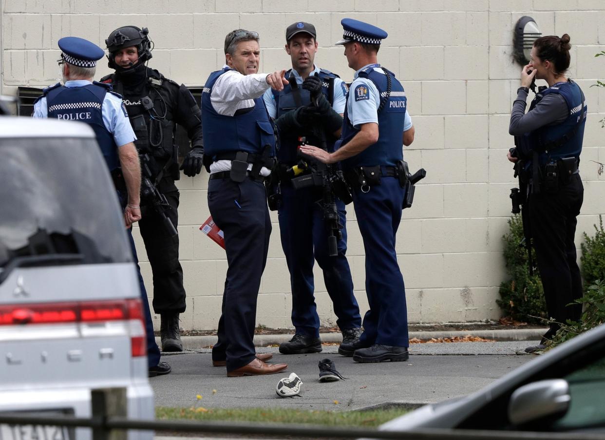 Police stand outside a mosque in central Christchurch, New Zealand: AP