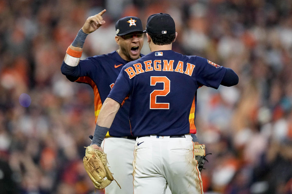 Houston Astros Alex Bregman (2) and Houston Astros Yuli Gurriel celebrate after Game 2 of baseball's American League Championship Series between the Houston Astros and the New York Yankees, Thursday, Oct. 20, 2022, in Houston. The Houston Astros won 3-2. (AP Photo/Eric Gay)