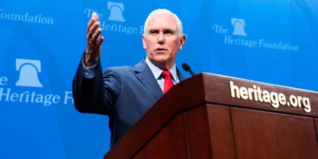 mike pence speaking at a podium during a conference