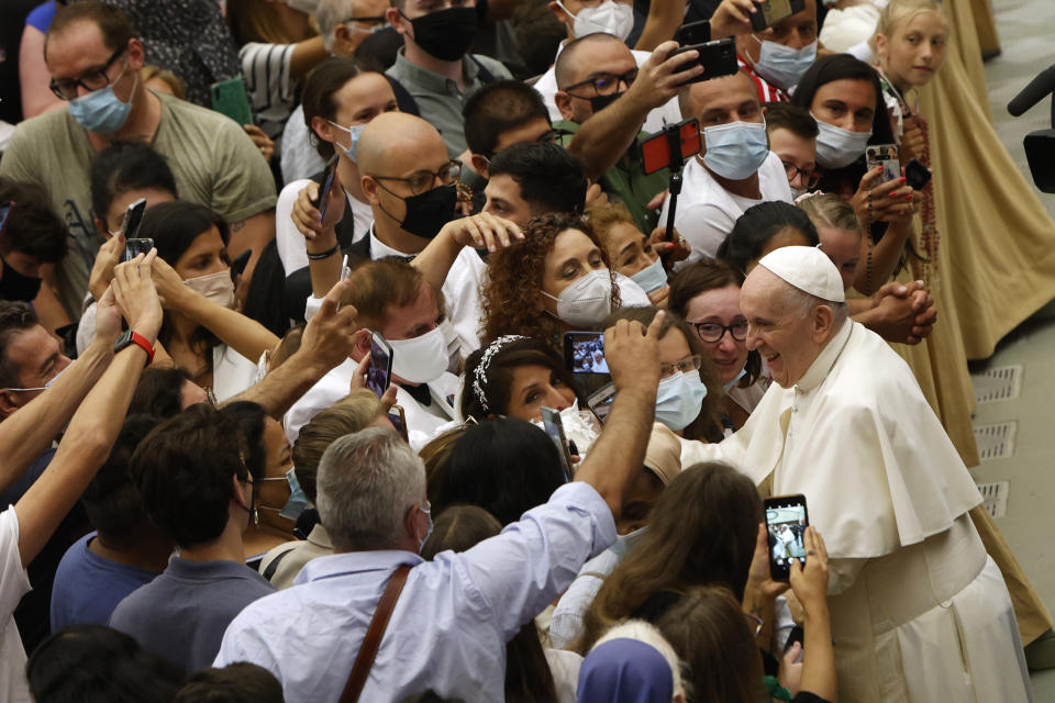 Pope Francis greets the faithful at the end of his weekly general audience in the Paul VI hall at the Vatican, Wednesday, Aug. 11, 2021. (AP Photo/Riccardo De Luca)