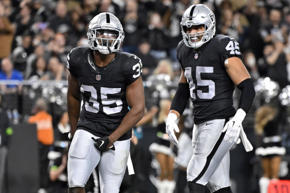 Las Vegas Raiders running back Zamir White (35) celebrates after scoring a touchdown against the Los Angeles Chargers during the first half of an NFL football game, Thursday, Dec. 14, 2023, in Las Vegas. (AP Photo/David Becker)